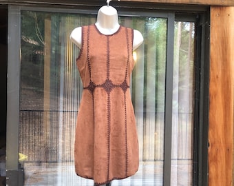 May include: A brown suede dress with brown stitching and a crochet design around the neckline and hem.