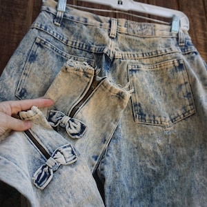 Bonjour acid washed high waisted high contrast denim jeans with bows and zippers at ankles