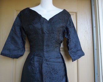 Vintage 1950s solid black  dress mid century with back metal fits like me4dium to large