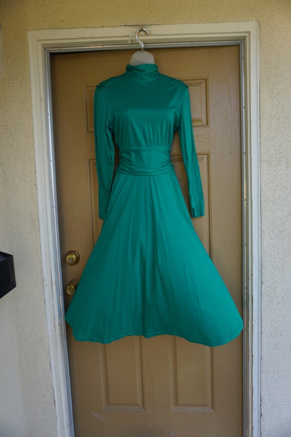 Small green dress with ruched shoulders and waist