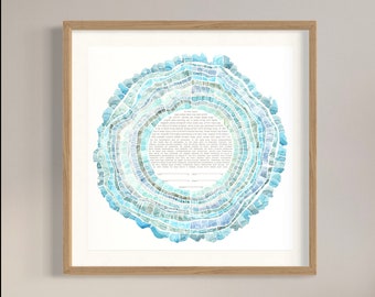 May include: A framed watercolor ketubah with a blue and green tree ring design. The ketubah text is written in Hebrew and English. The text reads, "...and they shall become one flesh..."