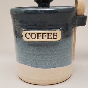 May include: Blue and white ceramic coffee jar with a wooden spoon and a label that reads "COFFEE".