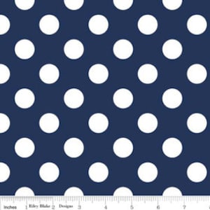 May include: Navy blue fabric with a white polka dot pattern.