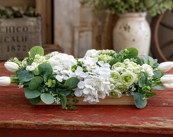 White and Green Floral Composition in a Dough Bowl