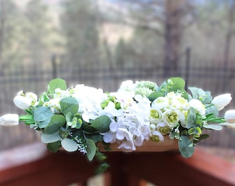 White and Green Floral Composition in a Dough Bowl