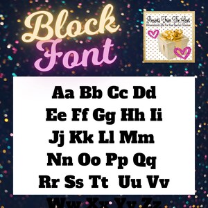 May include: A white sheet of paper with the words "Block Font" in pink and yellow letters. The alphabet is written in black block letters on the sheet of paper. The background is a dark blue with a gold glitter pattern.