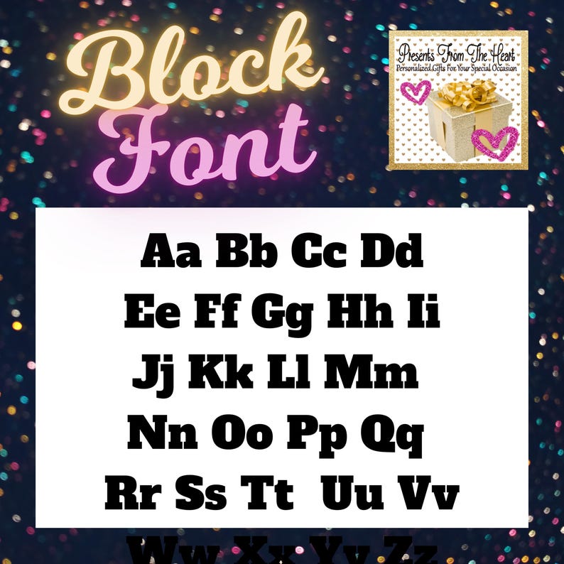 May include: A white sheet of paper with the words "Block Font" in pink and yellow letters. The alphabet is written in black block letters on the sheet of paper. The background is a dark blue with a gold glitter pattern.