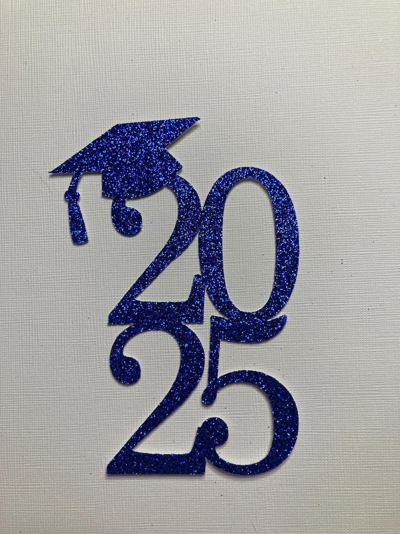 May include: A blue glitter graduation cap and the numbers 2025. The cap is on top of the number 2, and the numbers are vertically aligned. The background is a textured white surface. The image is suitable for graduation announcements or decorations.