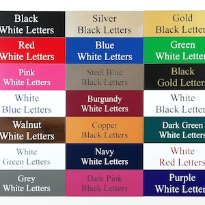 May include: A chart of 18 different color and letter combinations for plaques. The colors include black, red, pink, white, walnut, grey, silver, blue, steel blue, burgundy, copper, navy, dark pink, gold, green, dark green, and purple. The letters are either white or black.