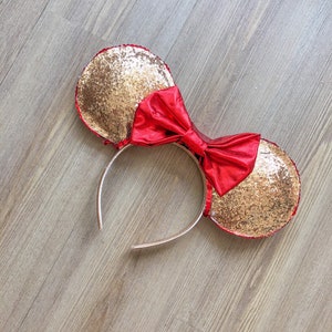 Gold funkeln Maus Ohren mit roten Bogen
