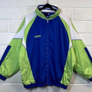 May include: A blue, green and white windbreaker jacket with a zip fastening and the word "DONWAY" printed on the front.