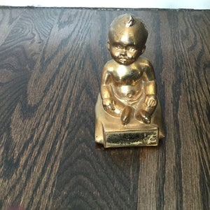 Primitive Vintage Cast Metal Baby on Pillow Figure Rustic