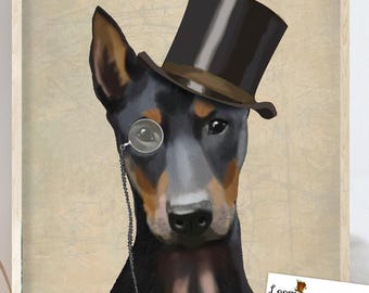 May include: A framed print featuring a Doberman Pinscher wearing a top hat and monocle. The dog has black and brown fur, with a serious expression. The background is a textured beige, and the print is labeled "Loopy Lolly by FabFunky".