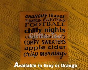 May include: Orange t-shirt with black text that reads "Crunchy Leaves, Pumpkin Everything, Football, Chilly Nights, Cozy Blankets, Comfy Sweaters, Apple Cider, Crisp Mornings". Available in Grey or Orange.