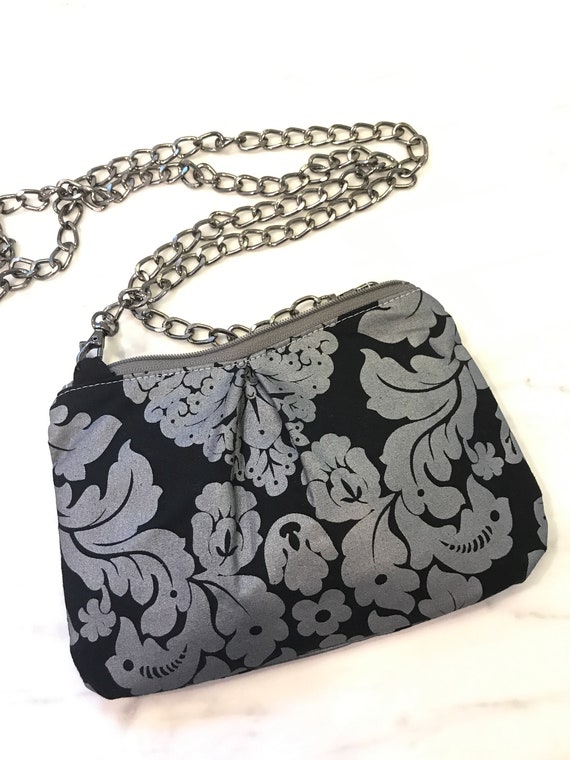 black and silver crossbody purse