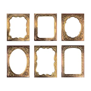 May include: Six ornate gold picture frames with different designs. The frames are all the same size and have a slightly distressed look.