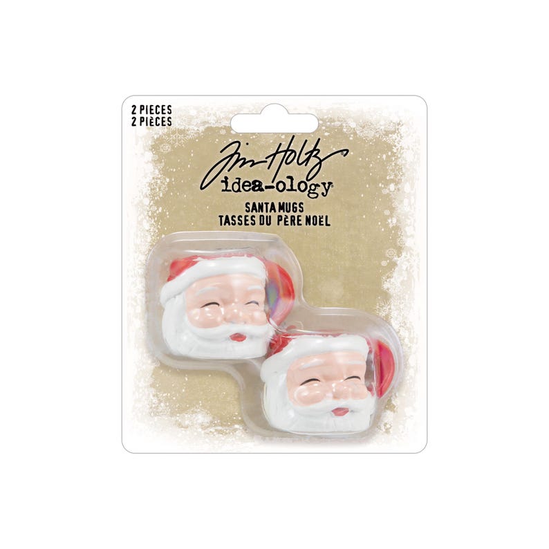 Puede incluir: Dos tazas con forma de Pap&aacute; Noel en un paquete de pl&aacute;stico transparente. Cada taza presenta una barba blanca, mejillas rosadas y un gorro rojo. El paquete incluye el texto "SANTA MUGS" y "2 PI&Egrave;CES".