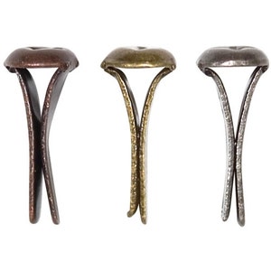 May include: Three metal rivets with a decorative top. The rivets are in three different finishes: copper, gold, and silver.