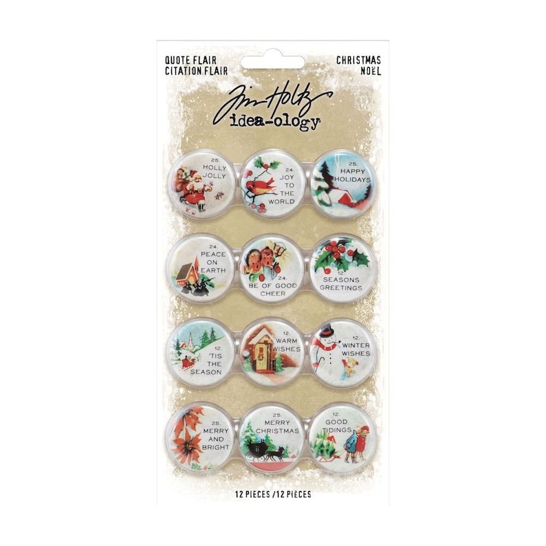May include: A set of 12 Christmas themed paper embellishments with various holiday greetings and images. The embellishments are round and have a vintage look. The embellishments are packaged on a card with the text "Jim Holtz idea-ology" and "12 pieces/12 pieces".