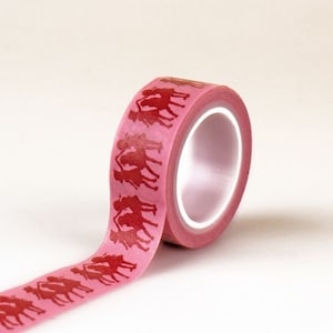May include: Pink washi tape with a repeating pattern of red silhouettes of people holding hands.