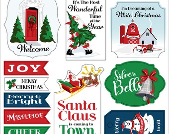 以下が含まれることがあります： サンタクロース、雪だるま、クリスマスツリー、リース、家など、さまざまなデザインが施された、クリスマスをテーマにした15個のチップボードフレーズのセット。フレーズには、「ホームフォーザホリデー」、「メリークリスマス」、「イッツザモーストワンダーフルタイムオブザイヤー」、「アイムドリーミングオブアホワイトクリスマス」、「シルバーベルズ」、「サンタクロースイズカミングトゥタウン」、「メリー＆ブライト」、「ミストルトー」、「チア」、「ジョイ」、「ウェルカム」、「ティスザシーズン」、「ハッピーホリデー」、「ウォームアンドコージー」、「シーズンズグリーティング」などがあります。
