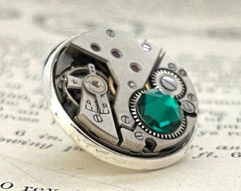 Steampunk Lapel Pin Badge, With Watch Mechanics. Vintage Watch Movement with Emerald Crystal & Silver Plated Backing.
