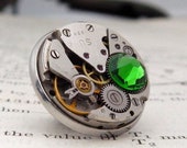 Steampunk Lapel Badge / Tie Tack / Brooch. Vintage Watch Mechanism Pin Badge with Fern Green Crystal