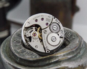 Steampunk Lapel Pin Badge, With Watch Mechanics. Vintage Swiss Watch Movement & Silver Plated Backing.