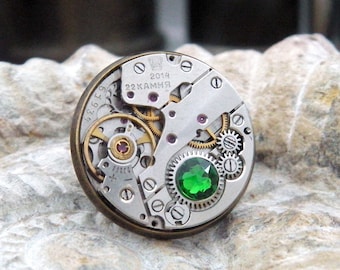 Steampunk Lapel Pin Badge with Watch Mechanics. Vintage Watch Movement & Green Crystal. Antique Bronze Colour Backing. Men's Birthday Gift