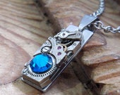 Small Steampunk Style Necklace, Featuring a Vintage Ladies Watch Mechanism and Capri Blue Swarovski Crystal.