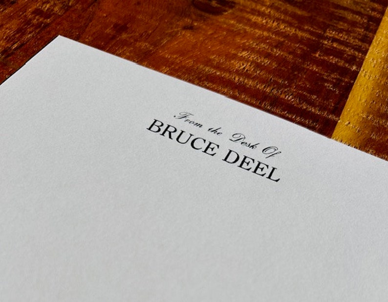 May include: White stationery with the text "From the Desk of BRUCE DEEL" printed in black ink.