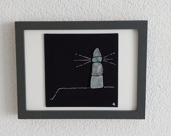 the lighthouse on the dune - collage with Seaglass, black canvas plate in the frame