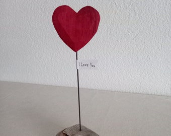 Driftwood sculpture with red heart