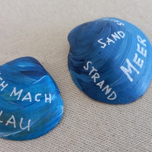 North Sea shell colored white blue - flotsam, lettering handwriting