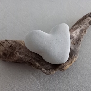 Driftwood root piece with chalk stone heart