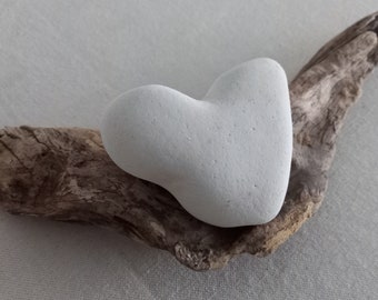 Driftwood root piece with chalk stone heart