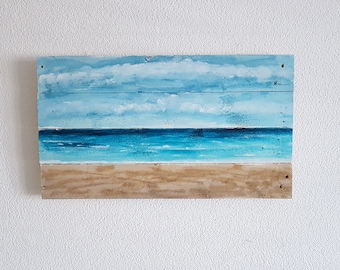 Sea view - picture on saw-raw wooden boards, collage with beach sand, pallets wood
