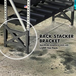 May include: A black Rack Stacker Bracket, designed to work with LGRP Tire Rack, is shown. The bracket is made of a dark material and features an X-shaped design. The image also shows a portion of a tire rack with black shelves and silver supports.