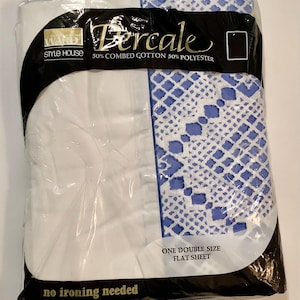 May include: A white and blue patterned flat sheet in a plastic package. The package says "Ward Style House Percale 50% Combed Cotton 50% Polyester" and "One Double Size Flat Sheet" and "No Ironing Needed".