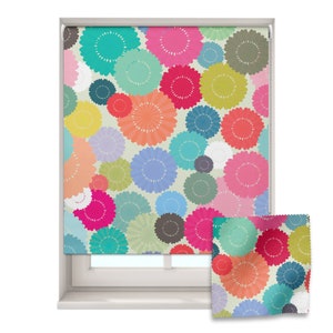 May include: A colourful window blind featuring a pattern of overlapping circles in shades of pink, blue, green, yellow, and orange. The circles have a textured, daisy-like design.