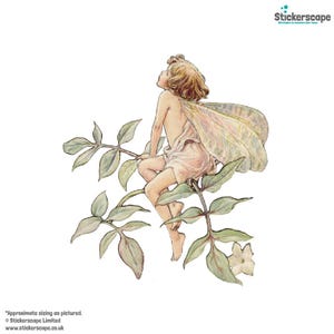 May include: A delicate fairy with wings sits on a branch of a leafy plant with white flowers. The fairy is wearing a pink dress and has blonde hair. The fairy is looking up at the sky.