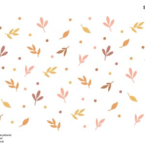 May include: A digital paper with a pattern of brown, pink, and yellow leaves and small brown dots on a white background.