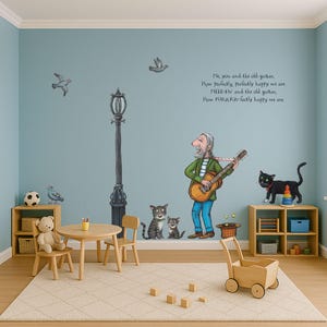 Può includere: Un'illustrazione colorata di un uomo che suona la chitarra con due gatti e un uccello. Il testo recita: "Io, tu e la vecchia chitarra. Quanto siamo perfettamente, perfettamente felici. MEEF-FW e la vecchia chitarra. Quanto siamo PURRR-fettamente felici."