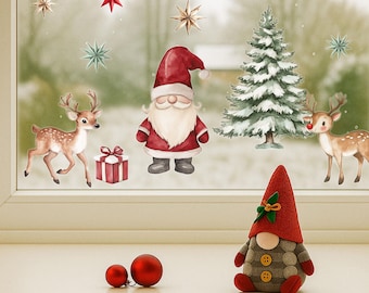 May include: A festive Christmas window scene with decorative stickers of a Santa Claus, reindeer, Christmas tree, and snowflakes. A gnome figurine and two red ornaments sit on the windowsill, creating a cozy holiday display.