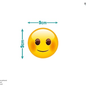 May include: Yellow smiley face emoji sticker with blushing cheeks and a slight smile. The sticker is 9 cm wide and 9 cm tall.