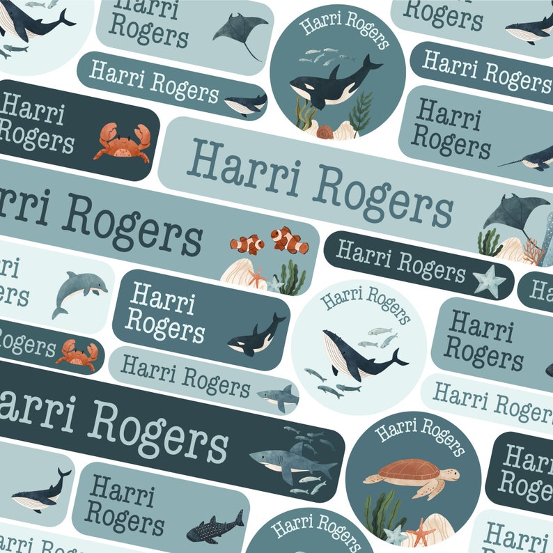 May include: A set of colourful, illustrated, personalised name labels featuring a variety of sea creatures, including whales, dolphins, sharks, stingrays, and a turtle. The labels are perfect for school supplies, lunchboxes, and other items.