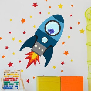 May include: A blue rocket ship with a window showing a purple alien inside. The rocket is flying through a field of orange and yellow stars.