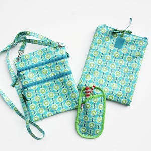 May include: A set of three ceramic mugs with a speckled, matte finish. The mugs are in shades of cream, light gray, and dark gray. Each mug has a simple, minimalist design and a rounded handle. The mugs are likely for coffee or tea.