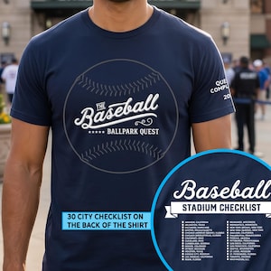 May include: A navy blue short-sleeve t-shirt featuring a white graphic of a baseball with the text "The Baseball Ballpark Quest". The shirt includes a list of 30 cities and a stadium checklist printed on the back, as indicated by the inset graphic.