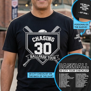 May include: Black t-shirt with a baseball theme. The front features the text "CHASING 30 BALLPARK TOUR" with crossed bats and a baseball. The back lists 30 cities. The sleeve can be personalized.